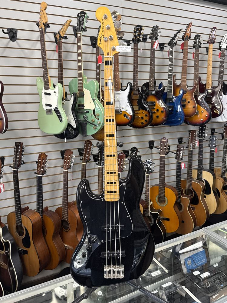 Black left-handed Squier by Fender Jazz Bass with maple neck